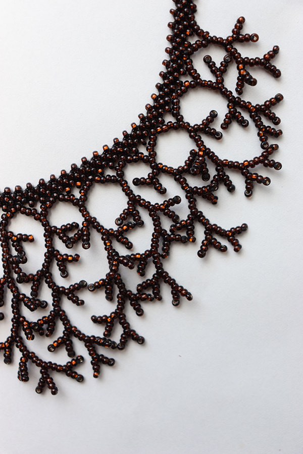 Artisanal Beaded Leather Crossbody Bag with Floral Tassels